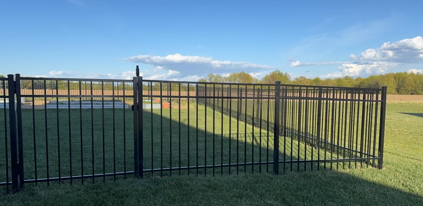 Black aluminum decorative fence installation in Palm Harbor, FL